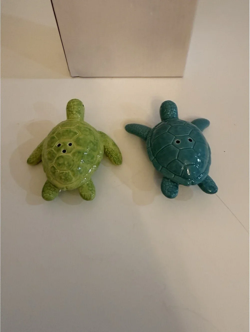 Cape Shore add a touch of ocean charm to your dining experience with the cape shore ceramic turtles salt & pepper set  colored in serene blue and green